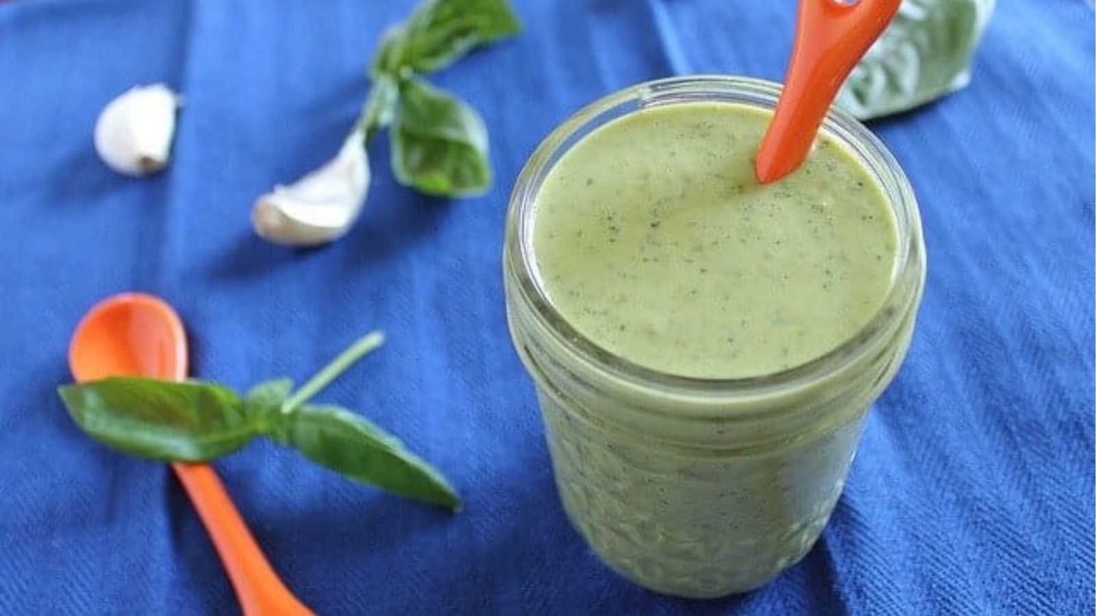 Close-up image of garlic herb tahini dressing.