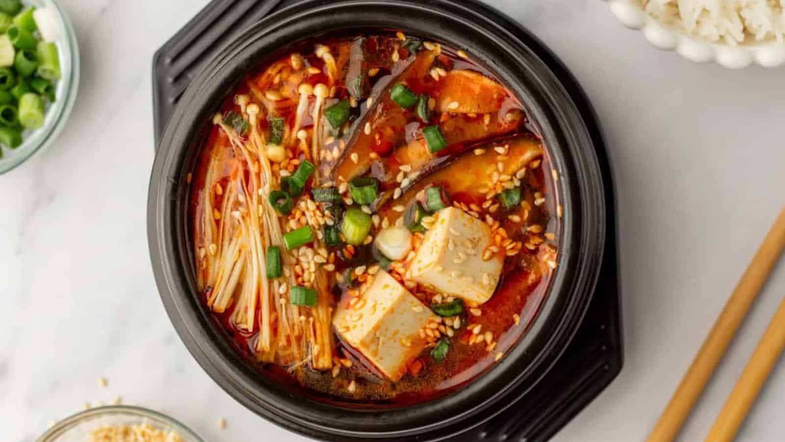 An overhead image of Korean tofu soup in a pot.