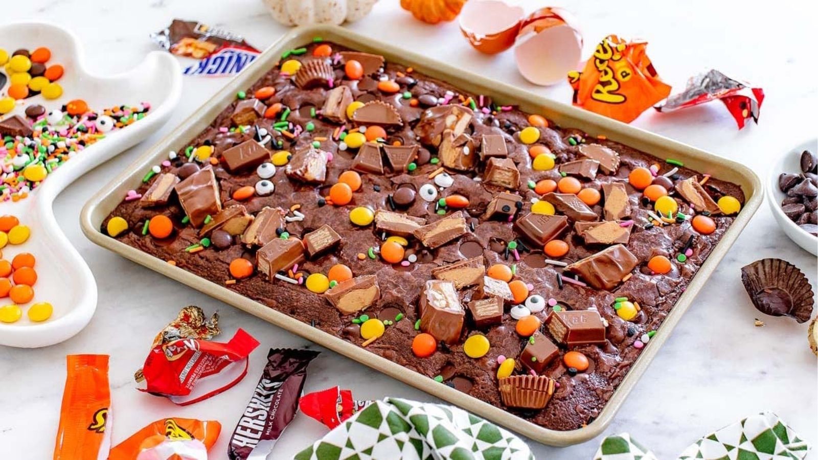 Leftover candy brownies in a sheet pan.