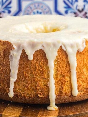 Lemon Chiffon Cake on a circular wooden board.
