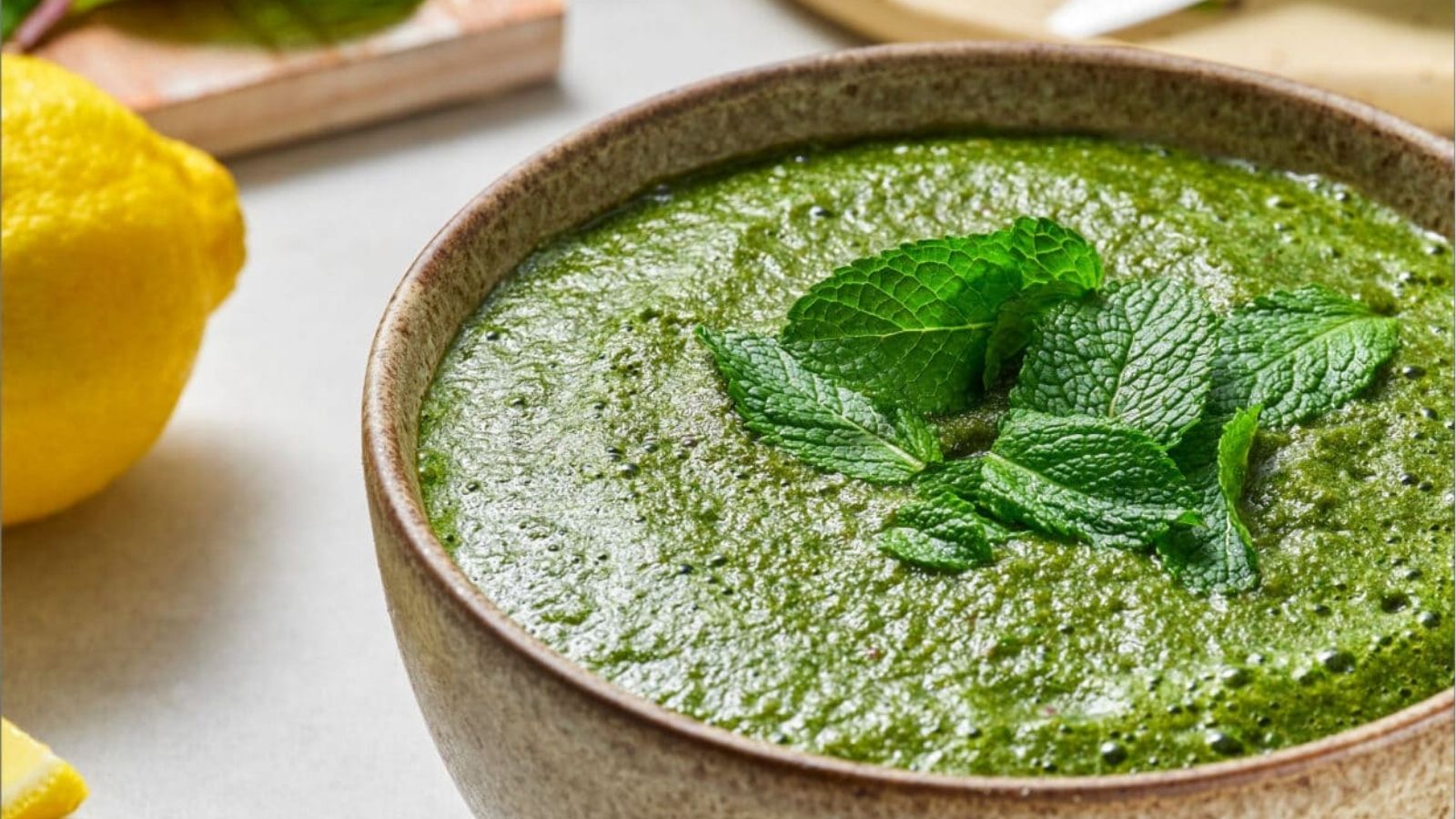 Close-up image of mint cilantro chutney in a bowl.