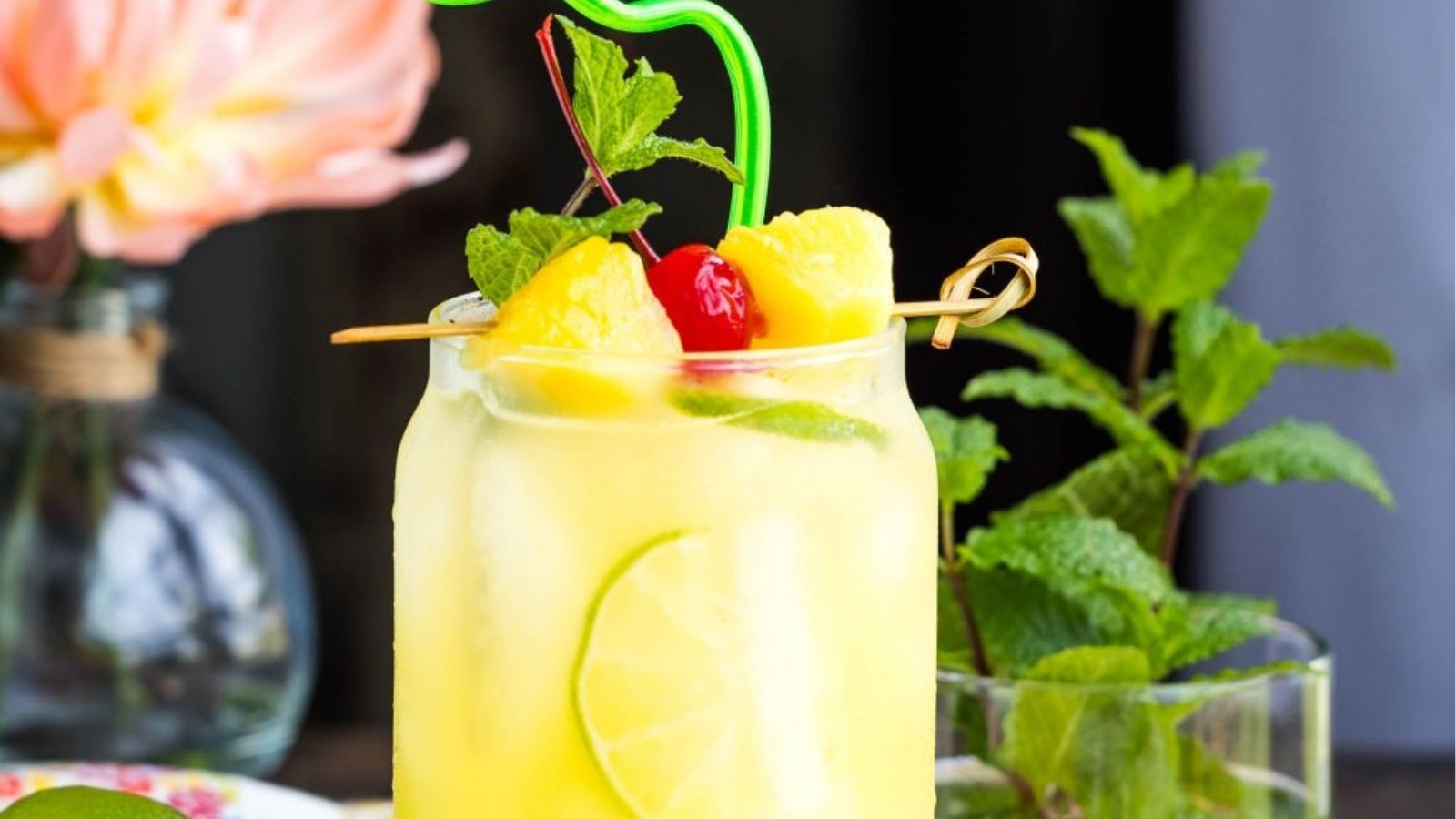 Close-up image of a half of glass of pineapple rum punch.