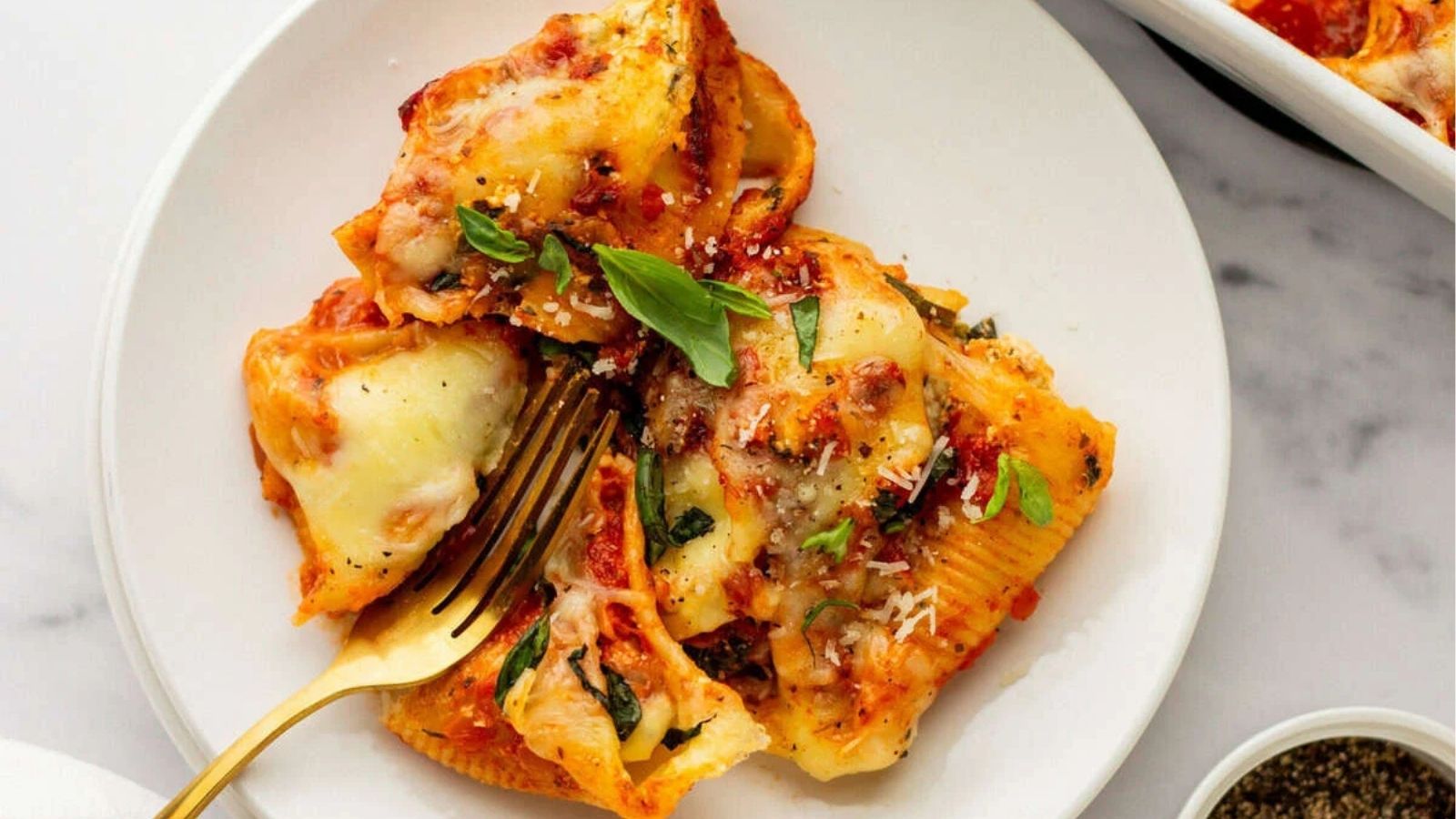 An overhead image of serving stuffed shells with ricotta.