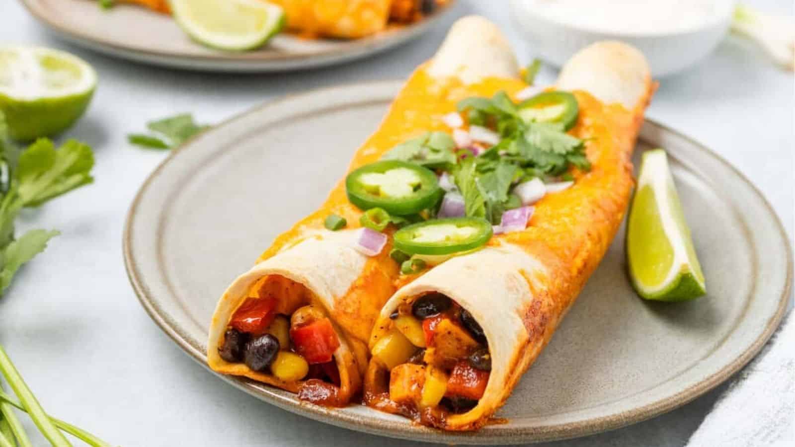 A close up image of a serving of vegetarian enchiladas on a plate.