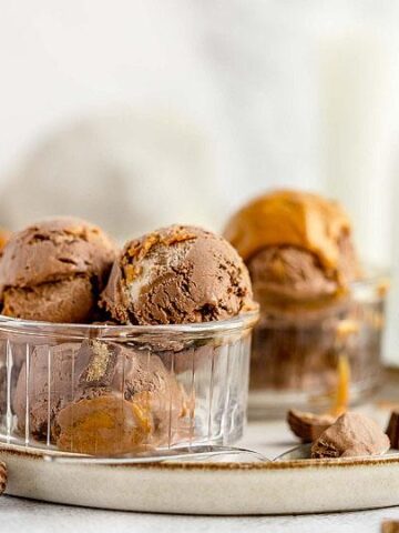 Scoops of Chocolate Peanut Butter Cup Ice Cream in a glass cup.