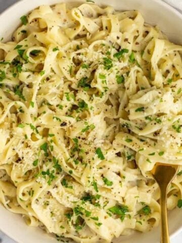 An overhead image of cottage cheese alfredo in a bowl.