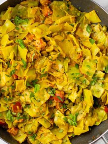 An overhead image of cooked cabbage curry.
