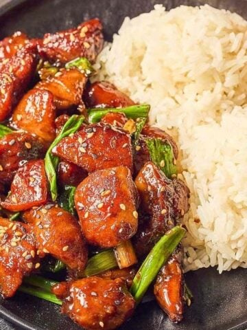 A plate of rice with Five Spice Chicken Stir Fry.