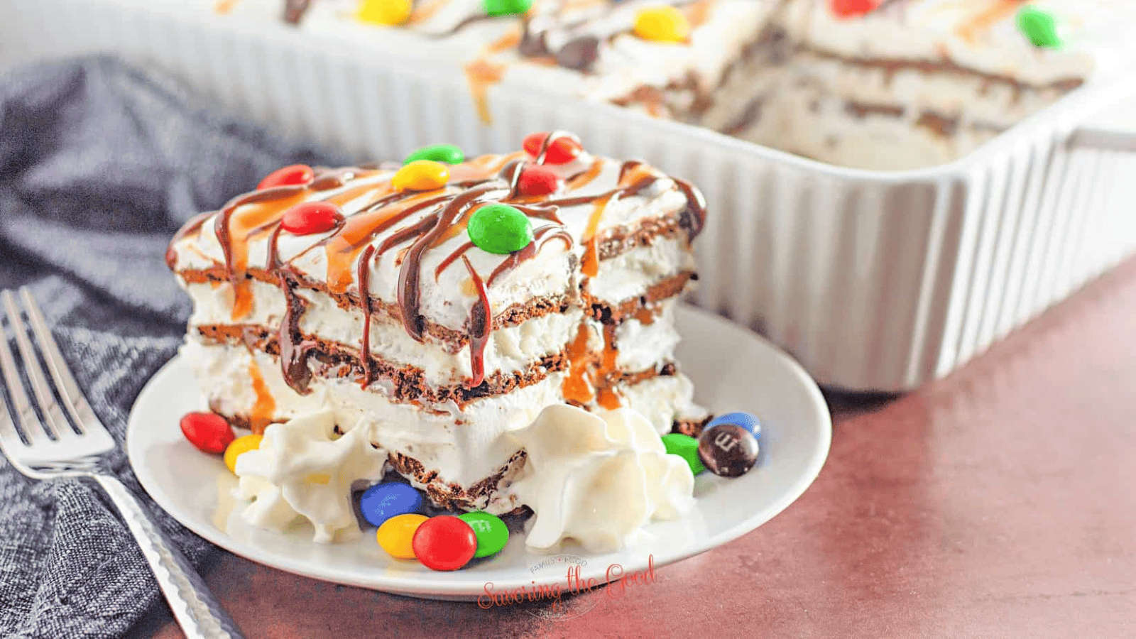 Ice Cream Sandwich Cake with Cool Whip on a plate.