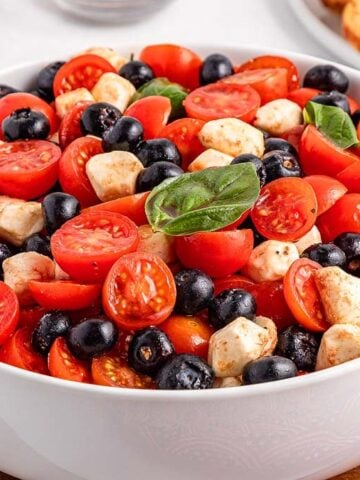 A huge bowl of Blueberry Tomato Caprese.