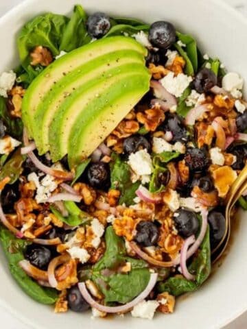 An overhead image of serving the salad in a bowl.