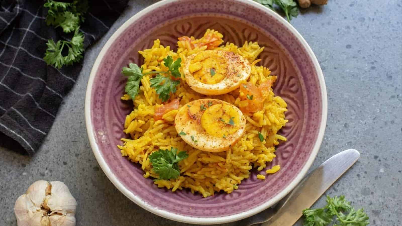 An overhead image of egg biryani in a serving bowl.