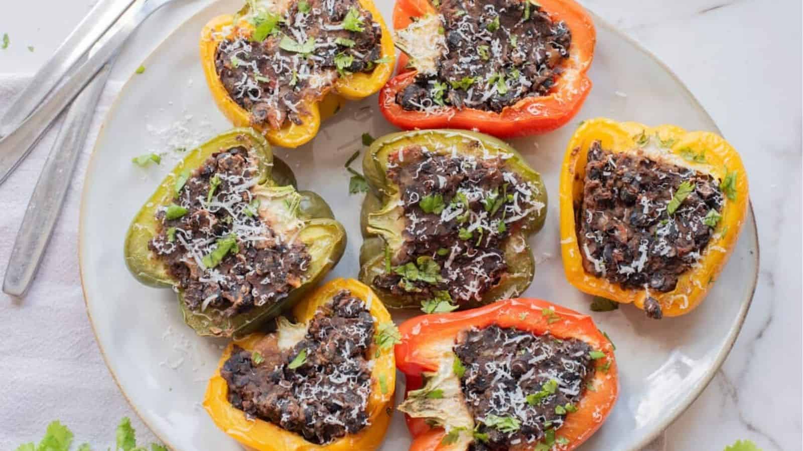 Close-up image of a plate black bean stuffed peppers.