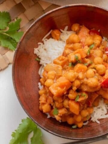 Bowl of West African peanut stew served over rice.