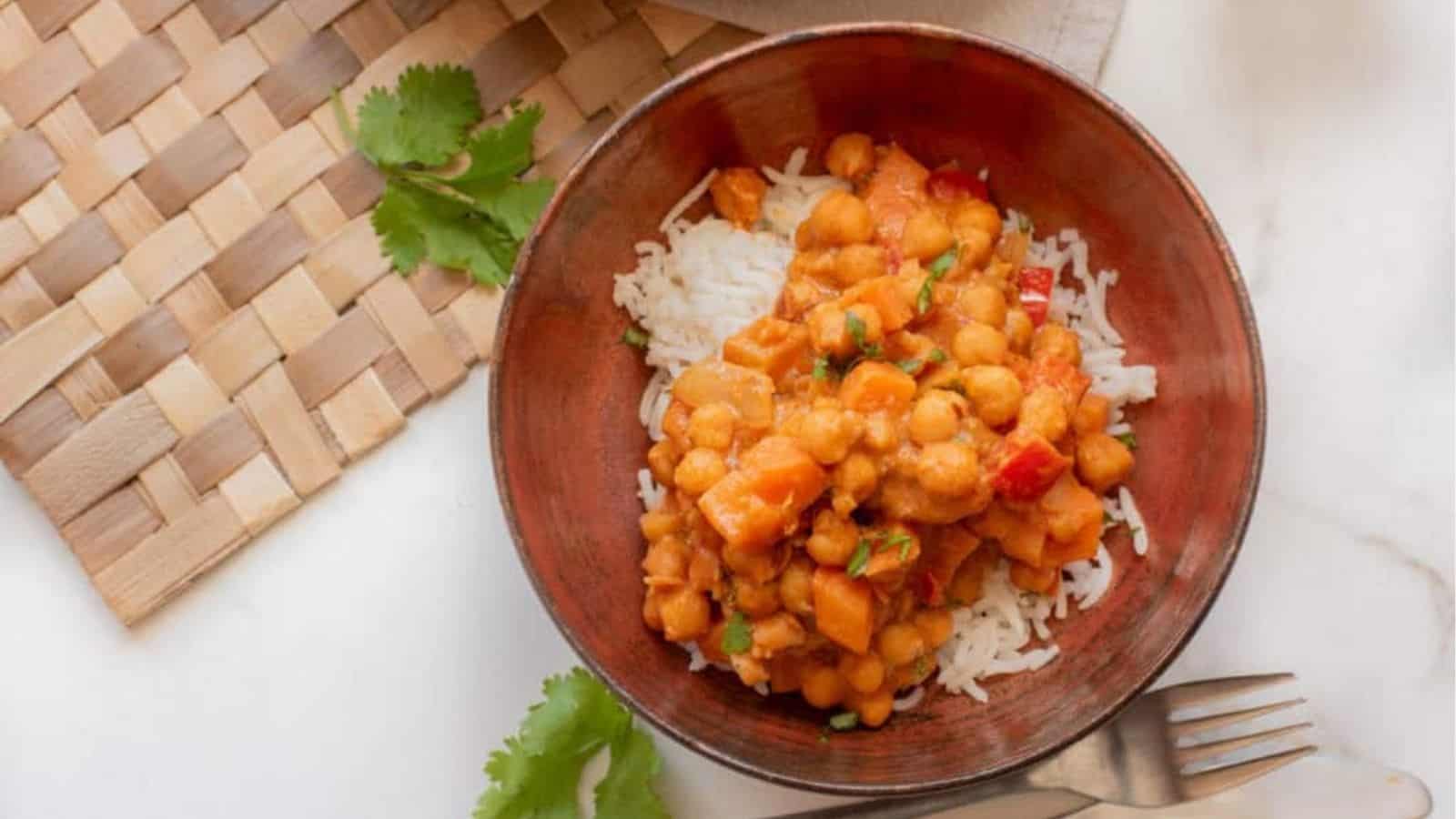 Bowl of West African peanut stew served over rice.