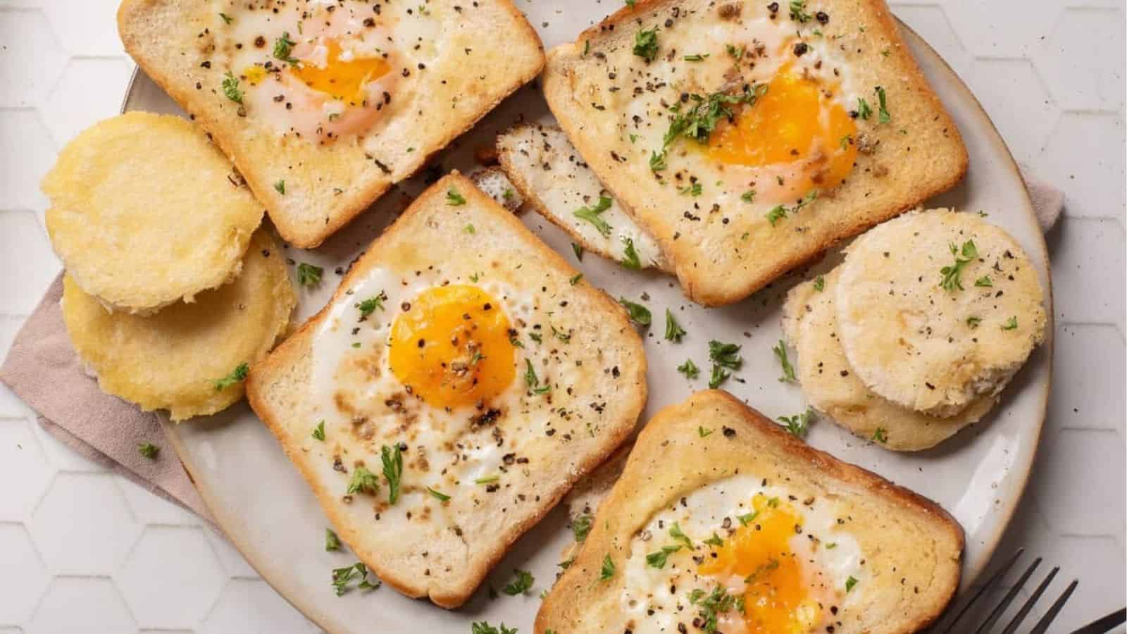 An overhead image of egg in a hole toasts.