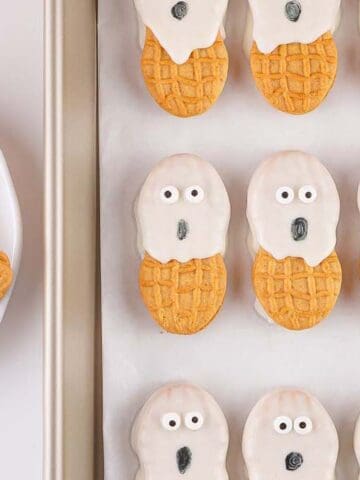 Nutter Butter Ghost Cookies on a tray.