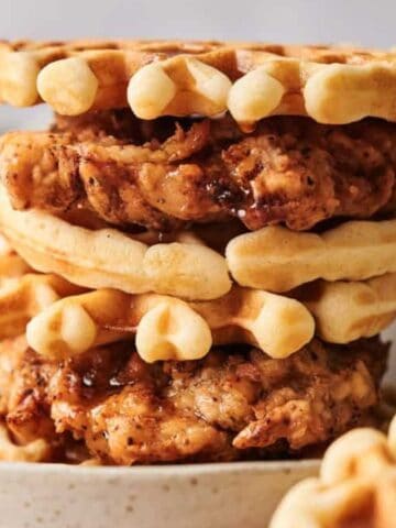 A stack of Chicken and Waffles on a plate.