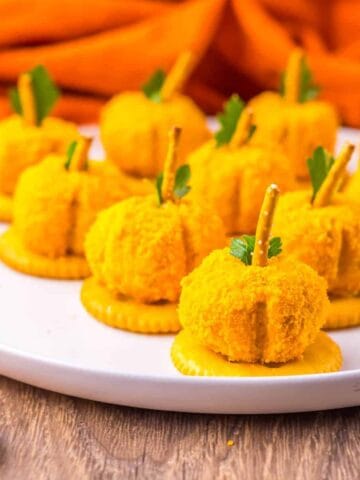 Mini Pumpkin Cheese Balls on a plate.