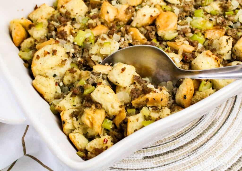An image of Sage and Sausage Stuffing with a spoon.