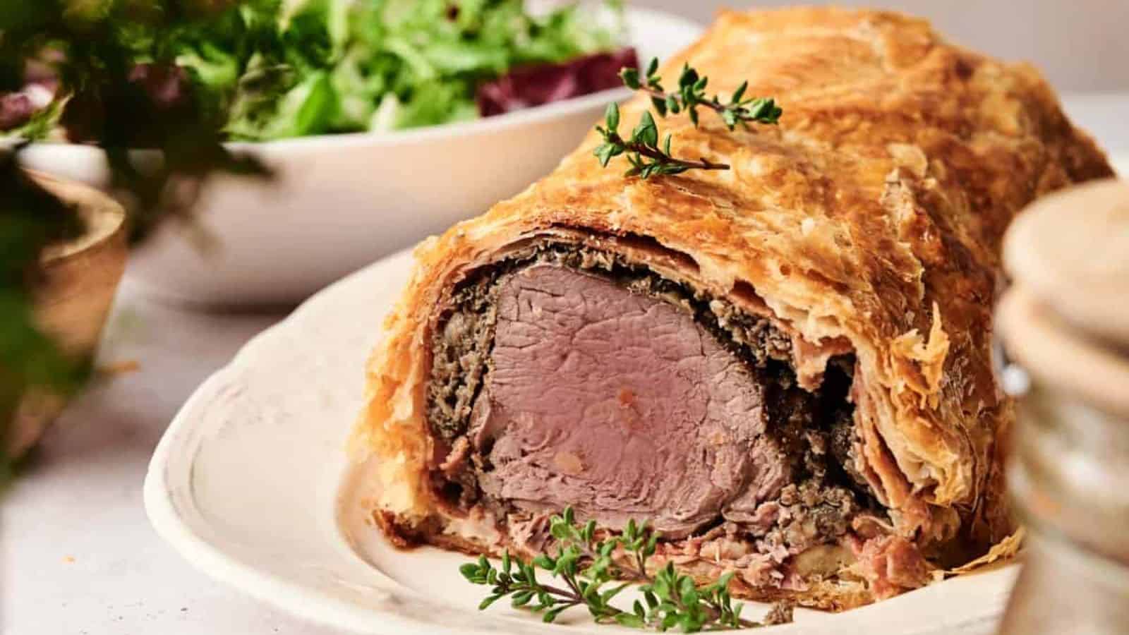 A close-up of Beef Wellington on a plate.
