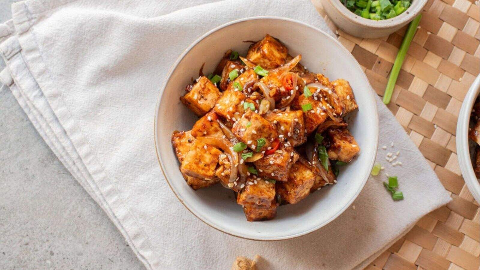 An overhead image of black pepper tofu in a bowl.