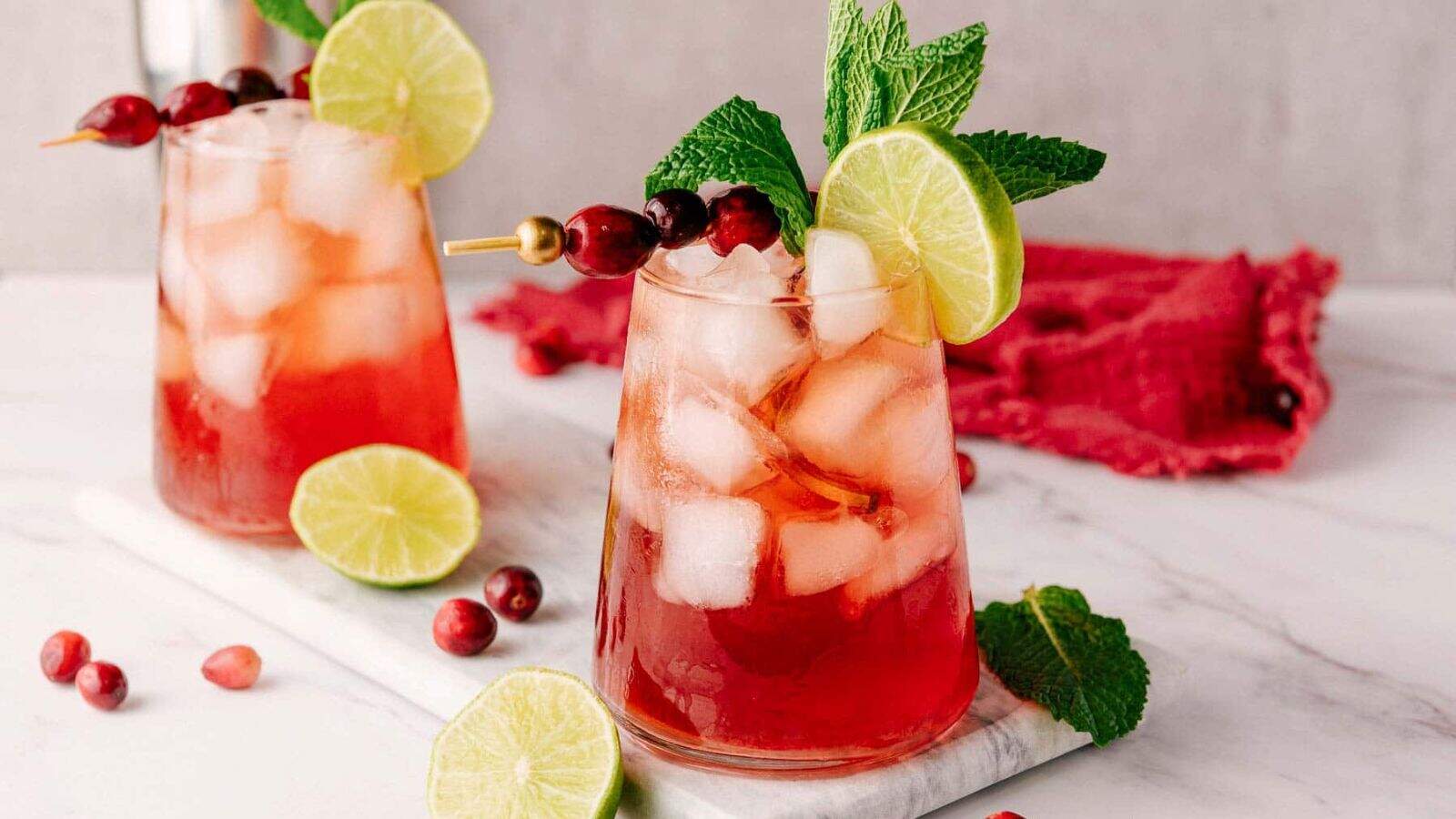 An image of two glasses of Cranberry Lime Mocktails.