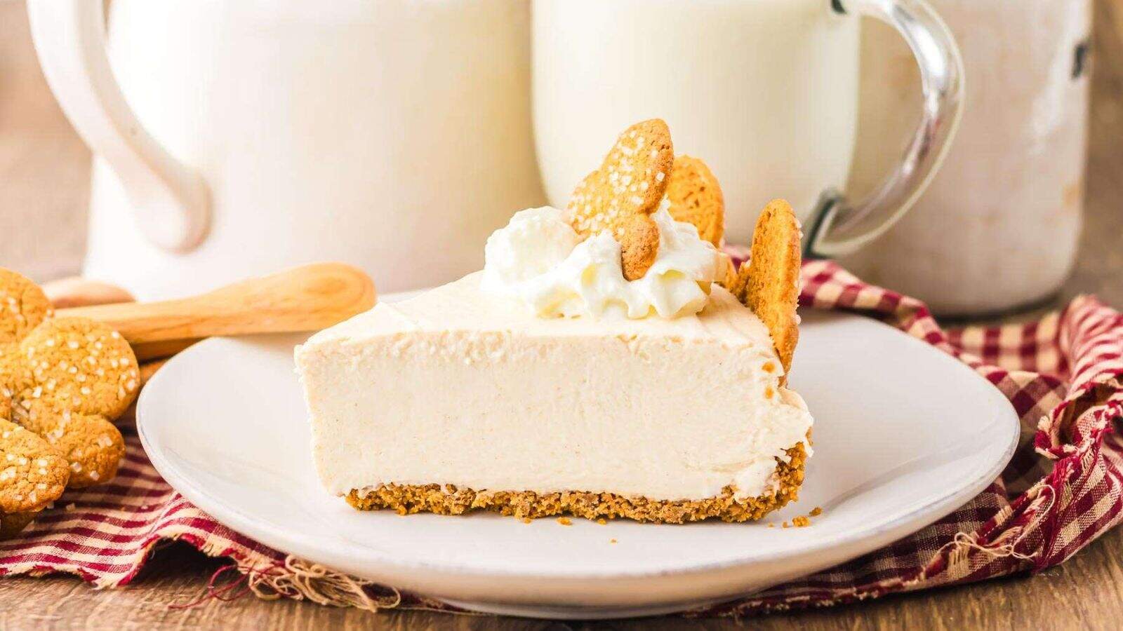 Side view of a slice of No Bake Gingerbread Cheesecake on a plate.