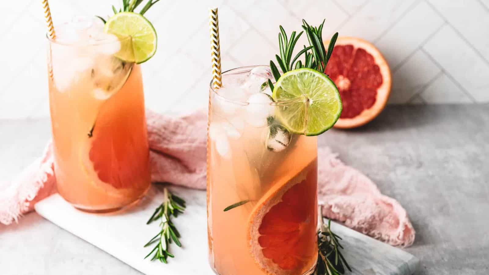 An image of two glasses of Rosemary Grapefruit Mocktails.