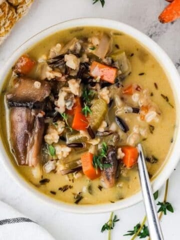 An overhead image of creamy wild rice soup in a bowl.