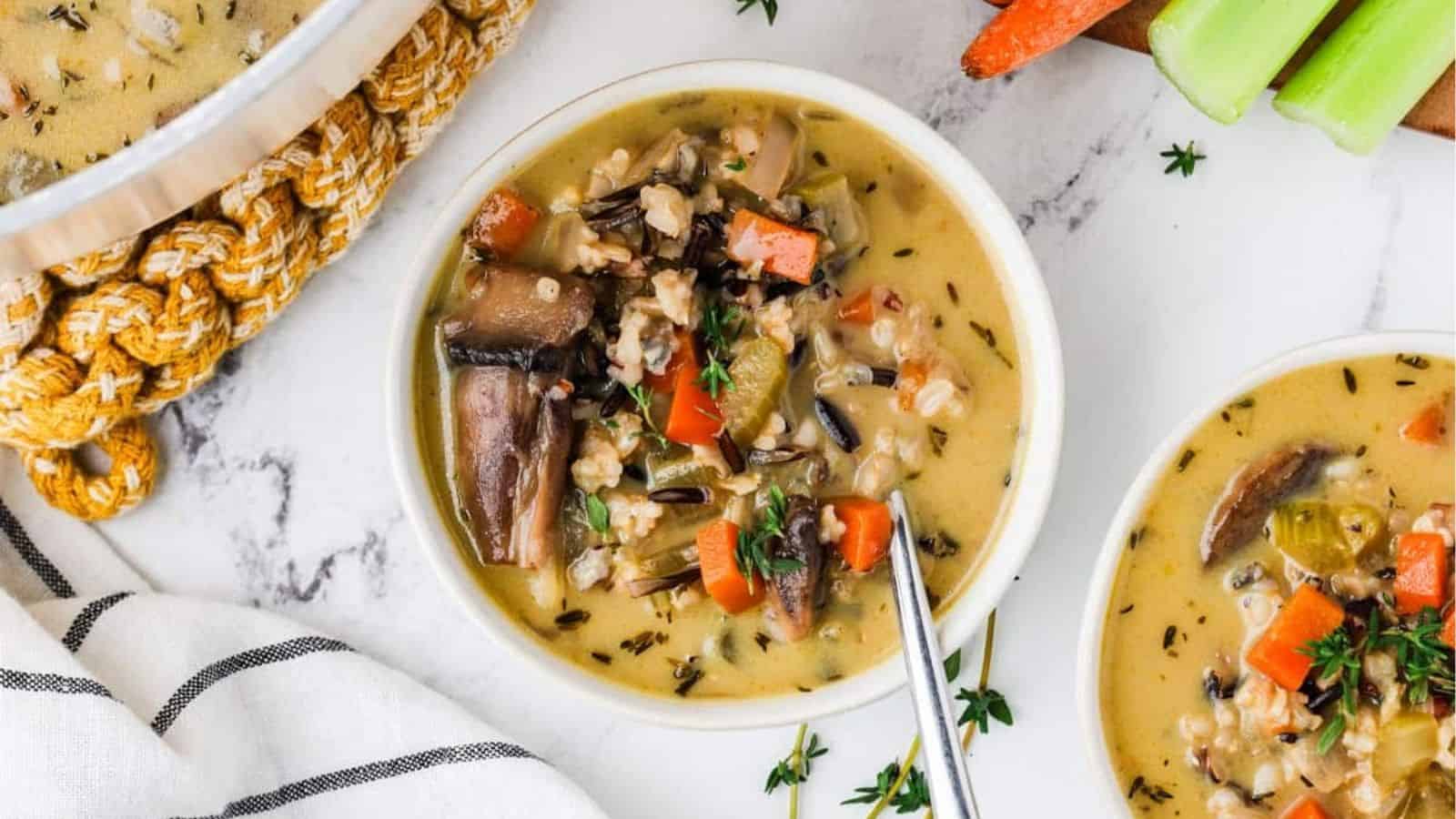 An overhead image of creamy wild rice soup in a bowl.
