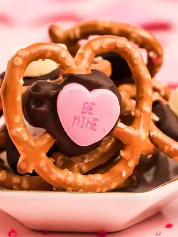 A small plate full of Valentine Pretzel Snack Bites.